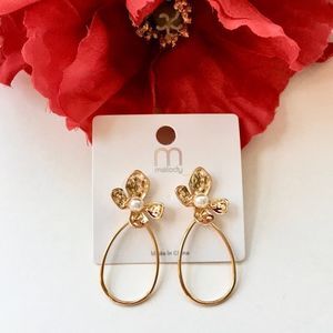 Gold Tone Elongated Hoops with Flower Pearl Accent